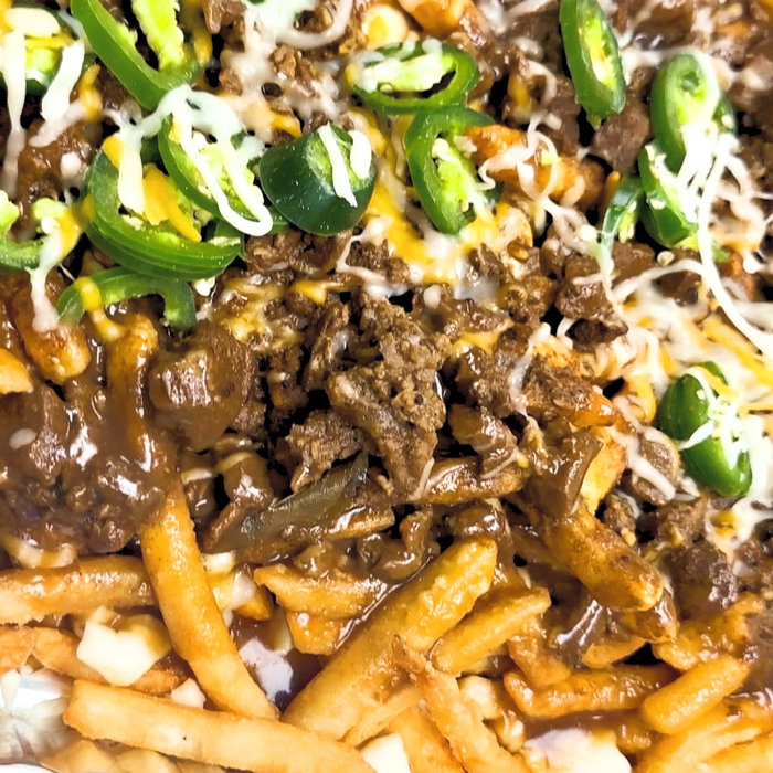 Mutton poutine with gravy and cheese at Confused Kitchen